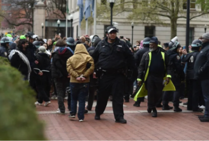 Caption: Police officers detain protesters at pro-Palestinian encampment on South Lawn at Columbia University, New York, on Thursday afternoon, April 18th