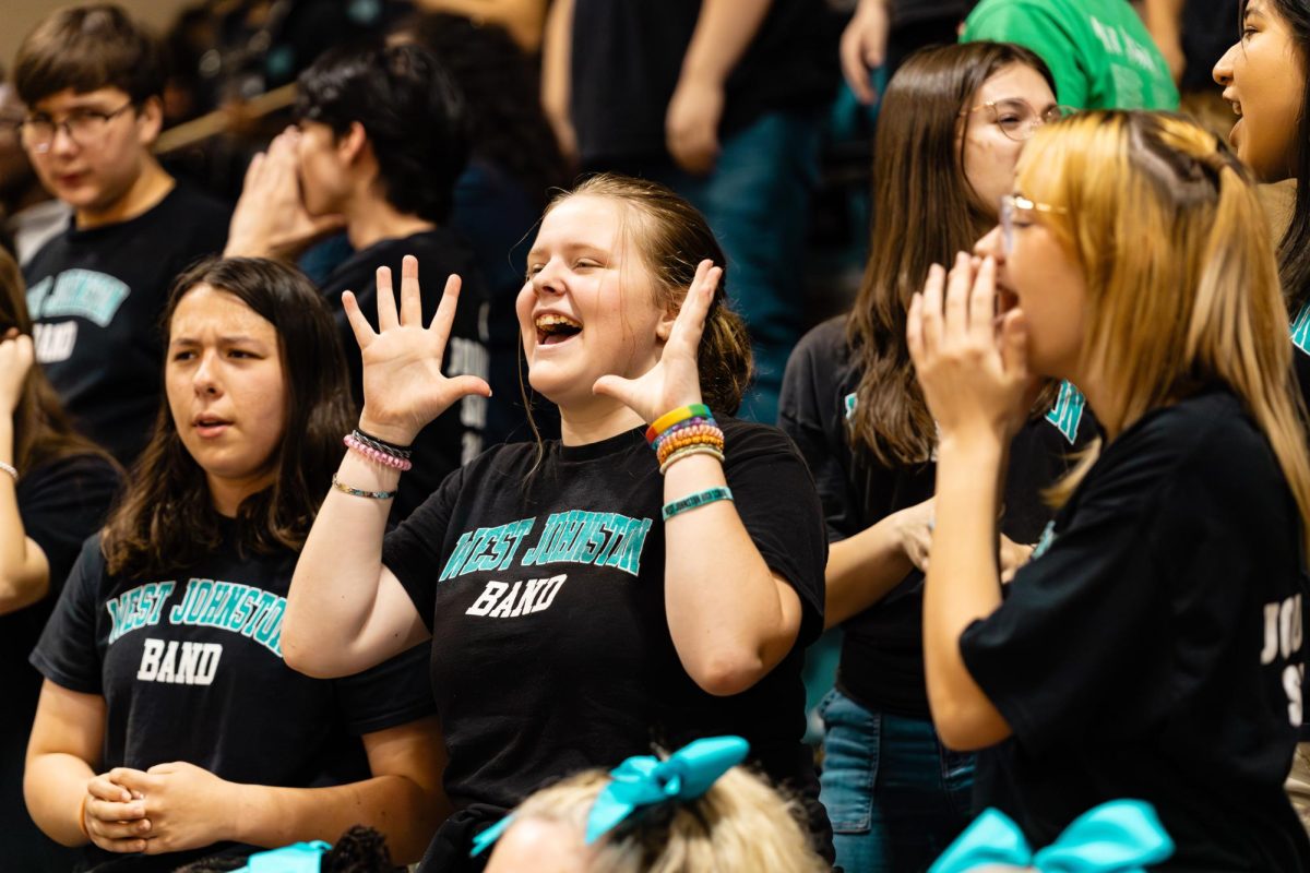 WJ band members hyping up the crowd with some of the songs and musical pieces played at normal school sporting events. 